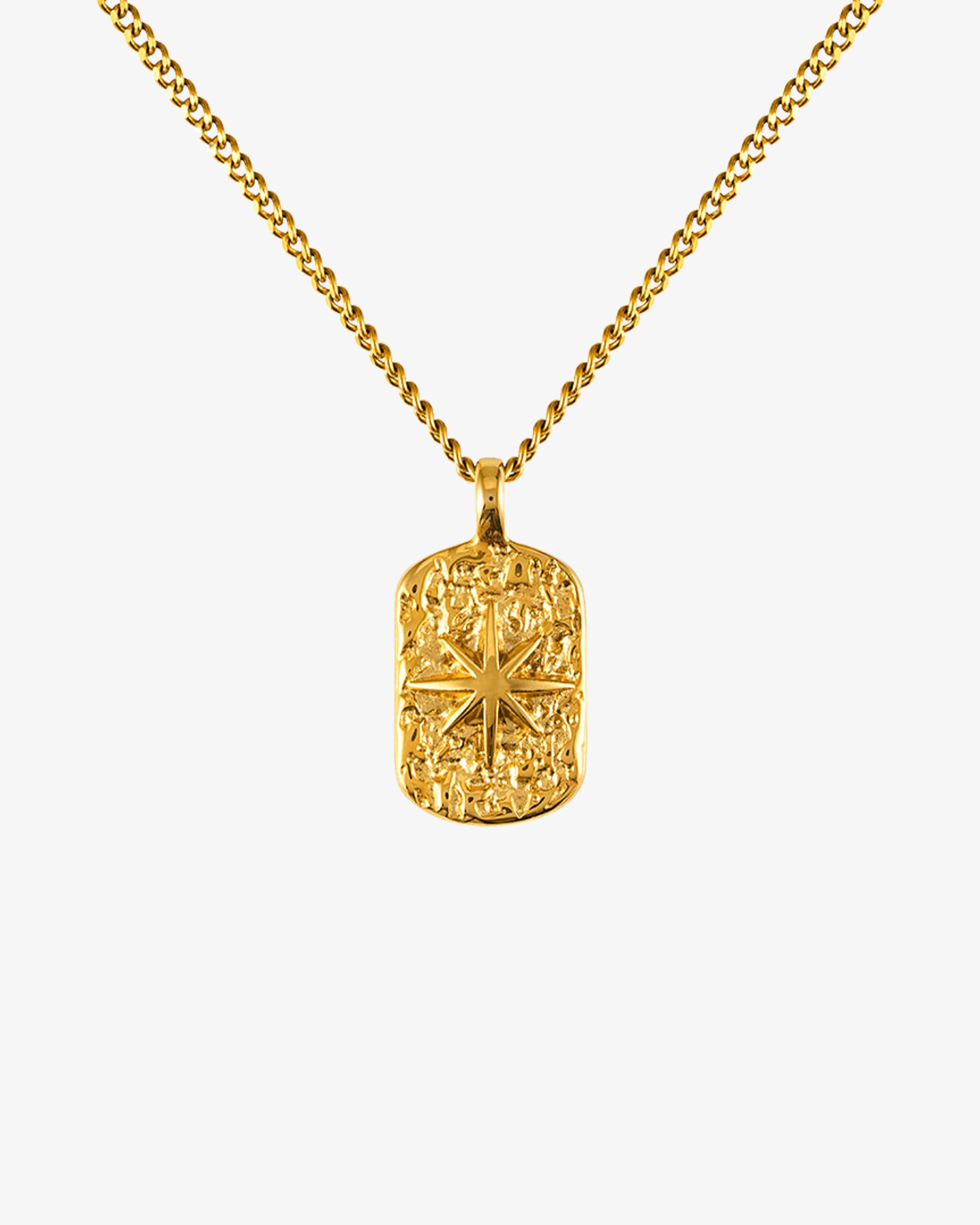 Gold IBZ necklace with a 50 cm chain plus 5 cm adjustable and a small round pendant worn by a model