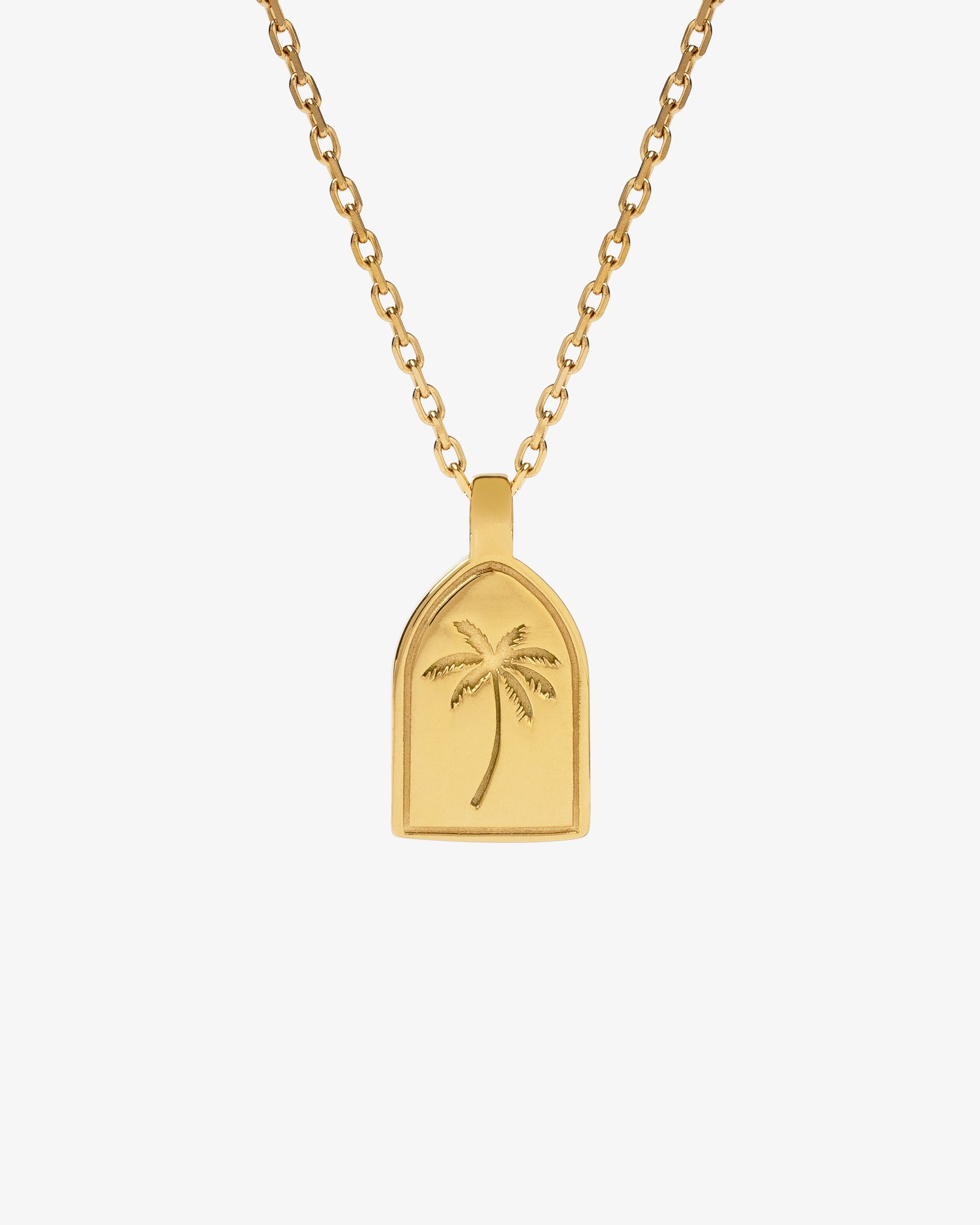 Gold palm tree pendant on a simple chain necklace