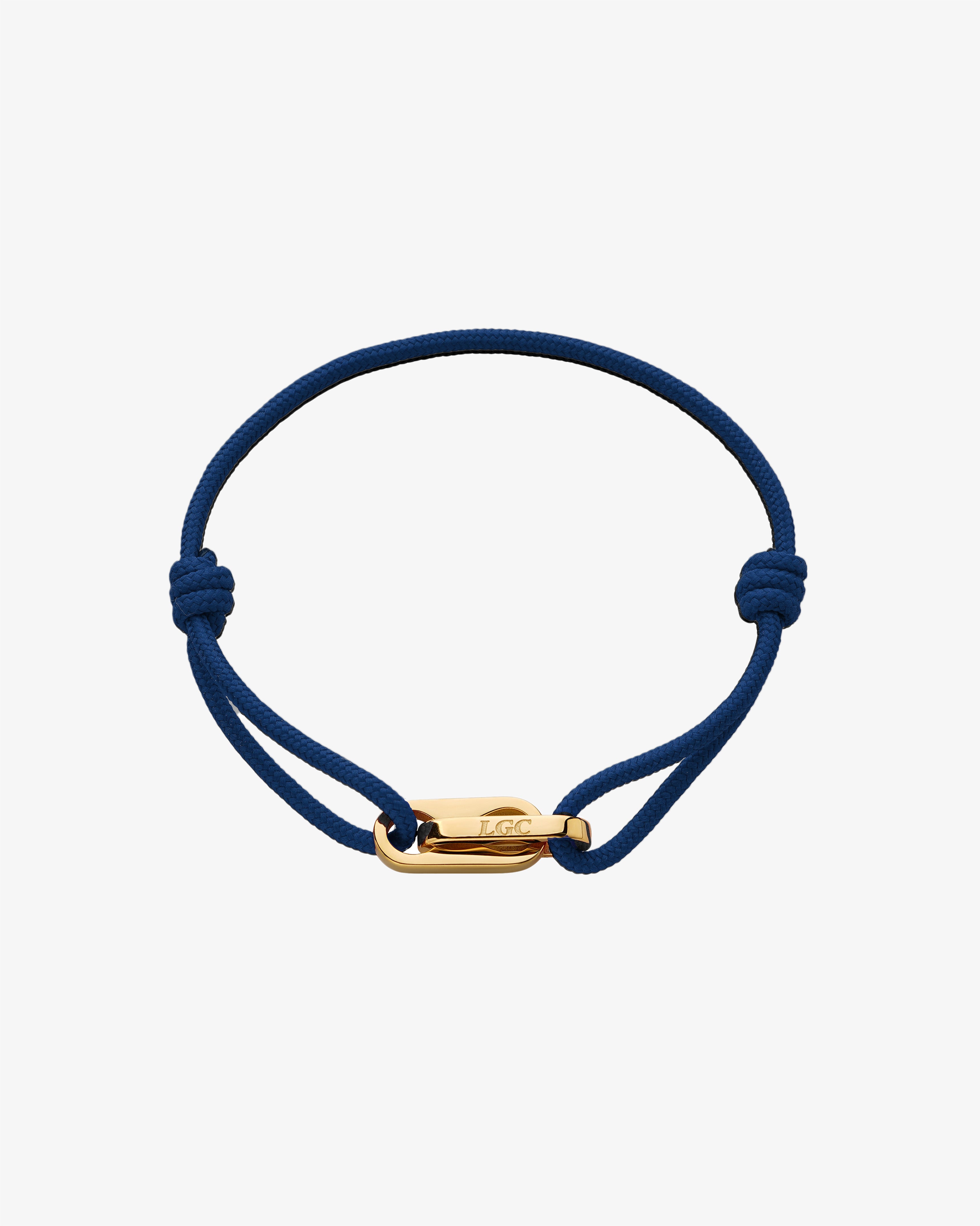 Atlantis Gold Bracelet with a blue braided cord and gold clasp on white background