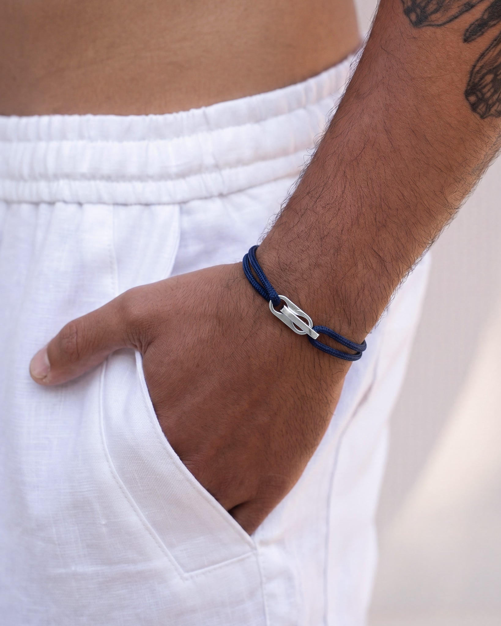 Atlantis bracelet featuring blue beads along a gold chain with a clasp
