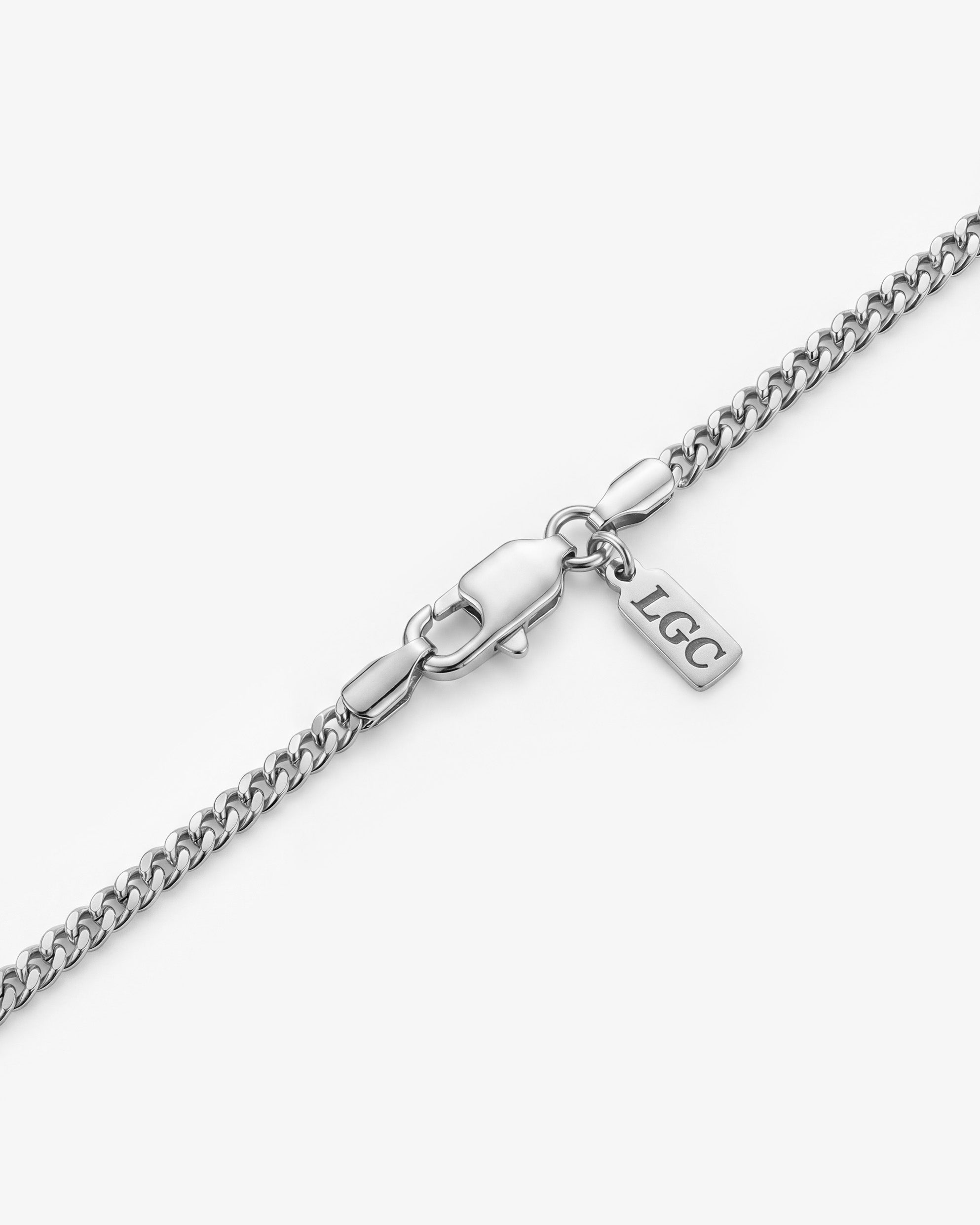 Volt necklaces in gold and silver finishes with bold rectangular black gemstone pendants