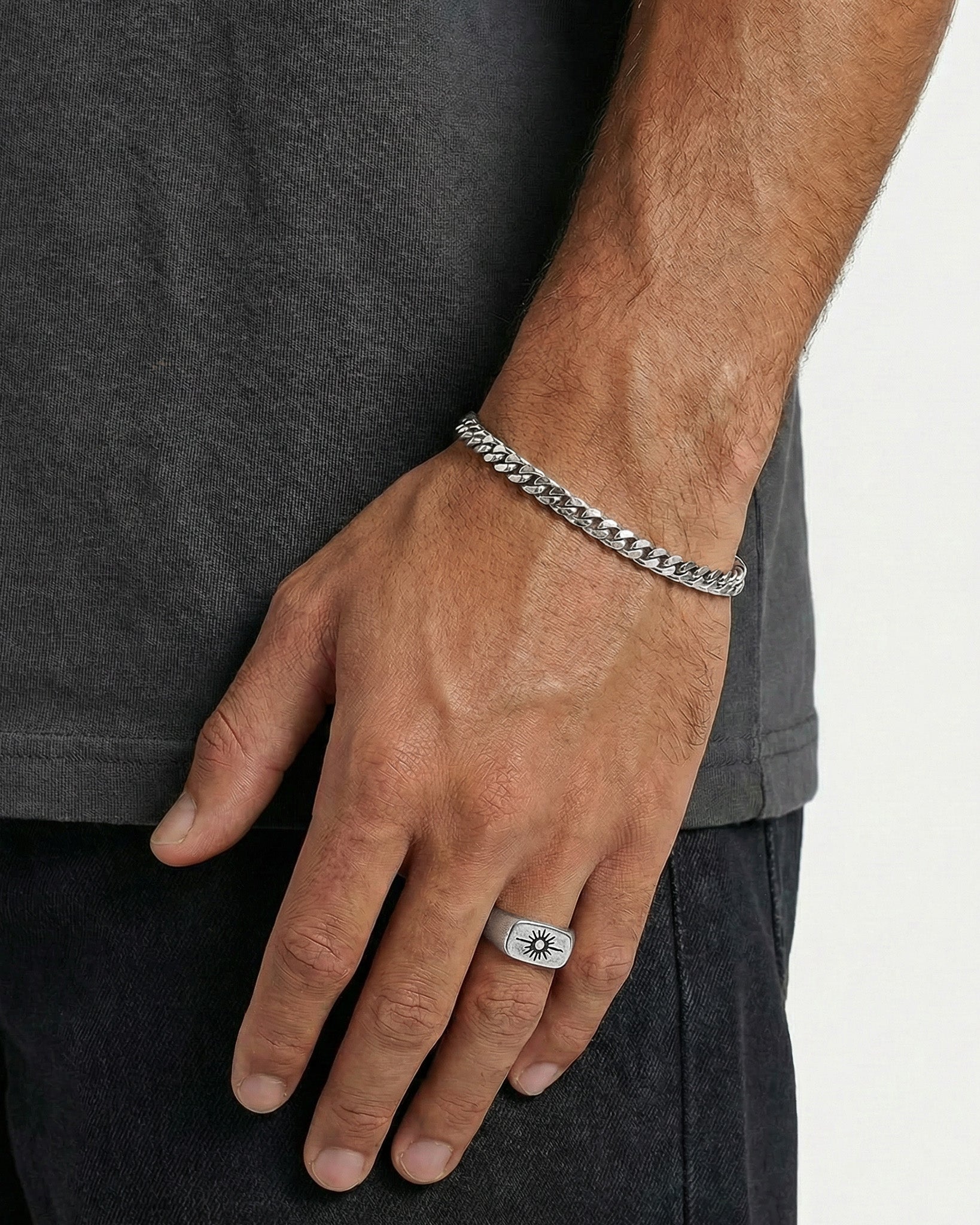 Man wearing a Cuban silver bracelet on his wrist