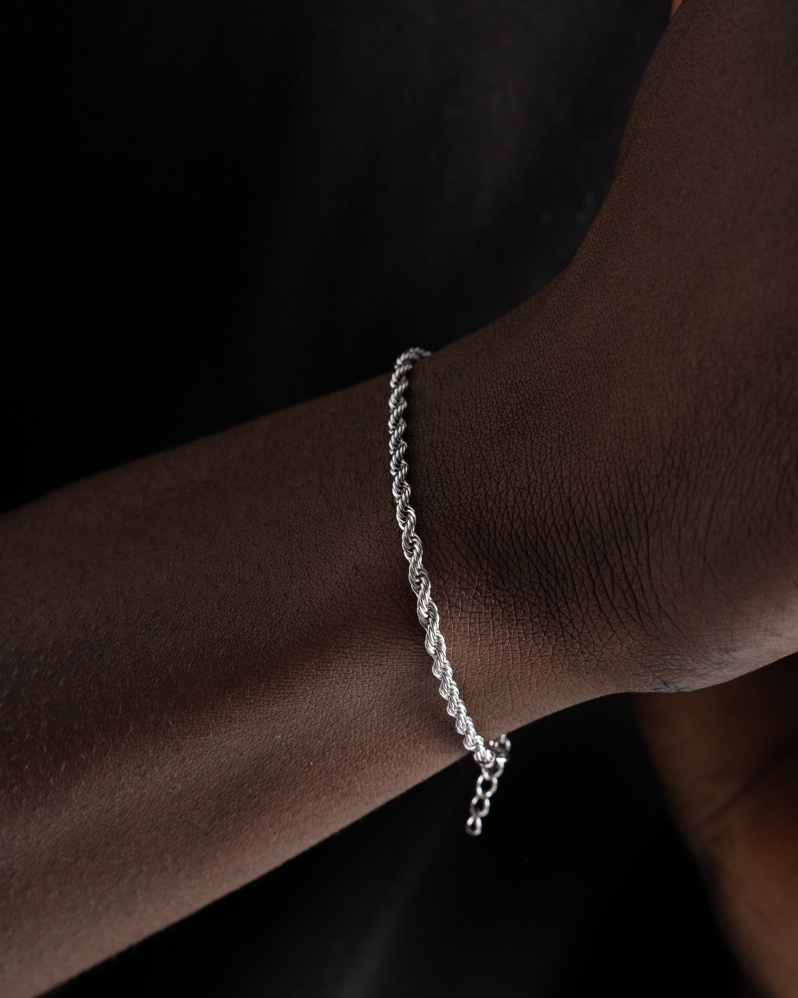 Close-up of Lazio Silver Bracelet draped along the wrist, highlighting the twisted rope design.