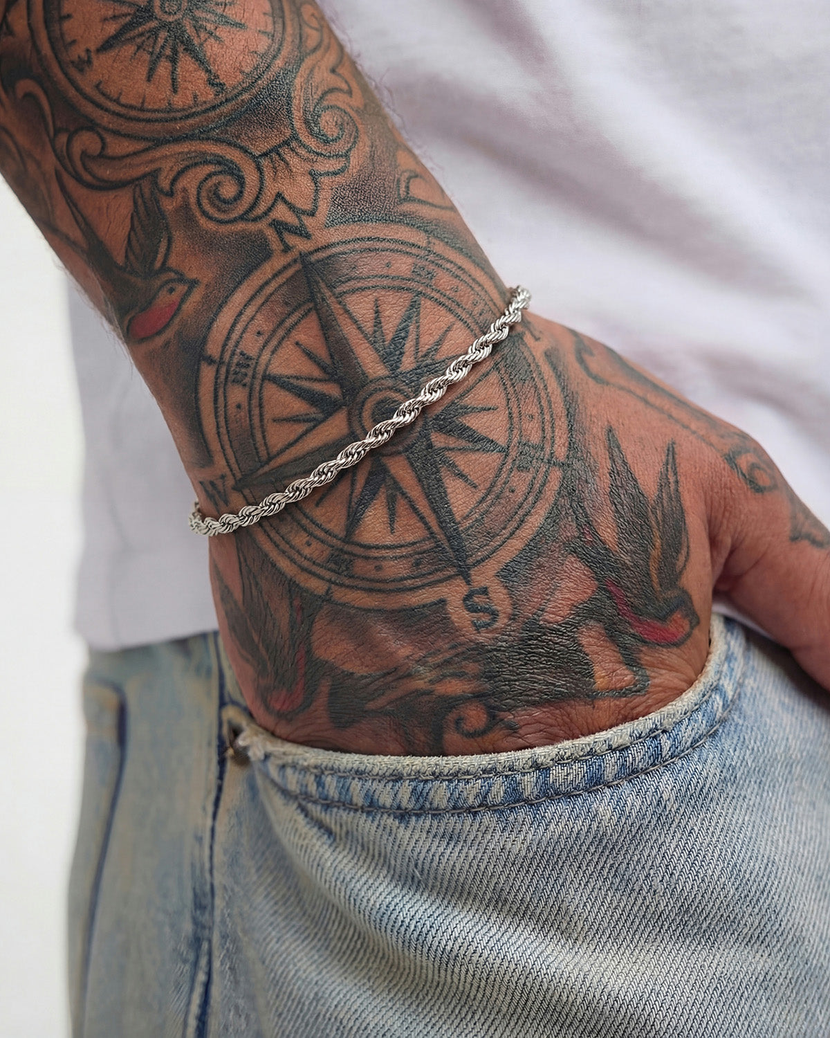 Wrist shot of Lazio Silver Bracelet worn on a tattooed forearm