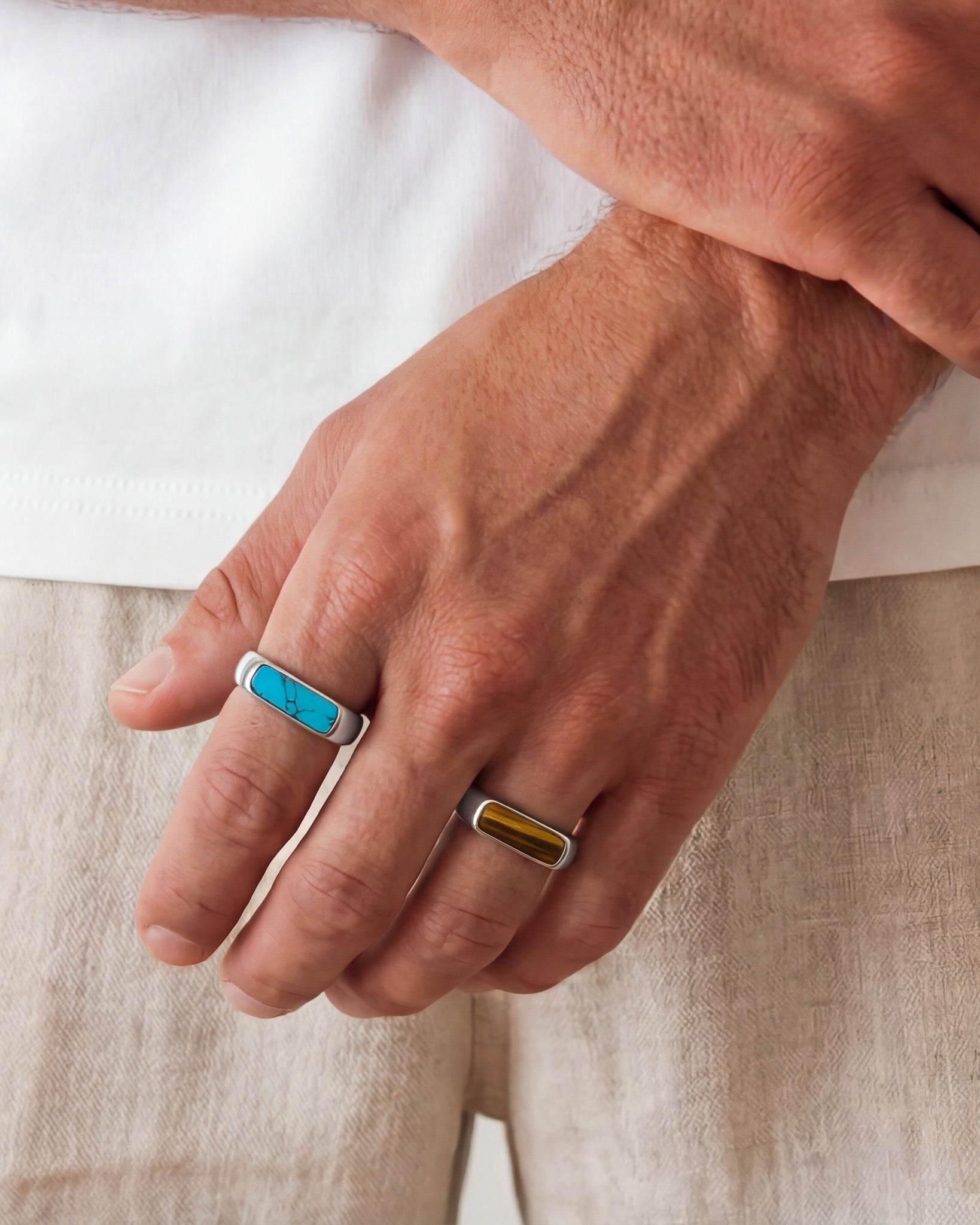 NOVA Silver Ring with turquoise inlay on a smooth silver band worn on a hand