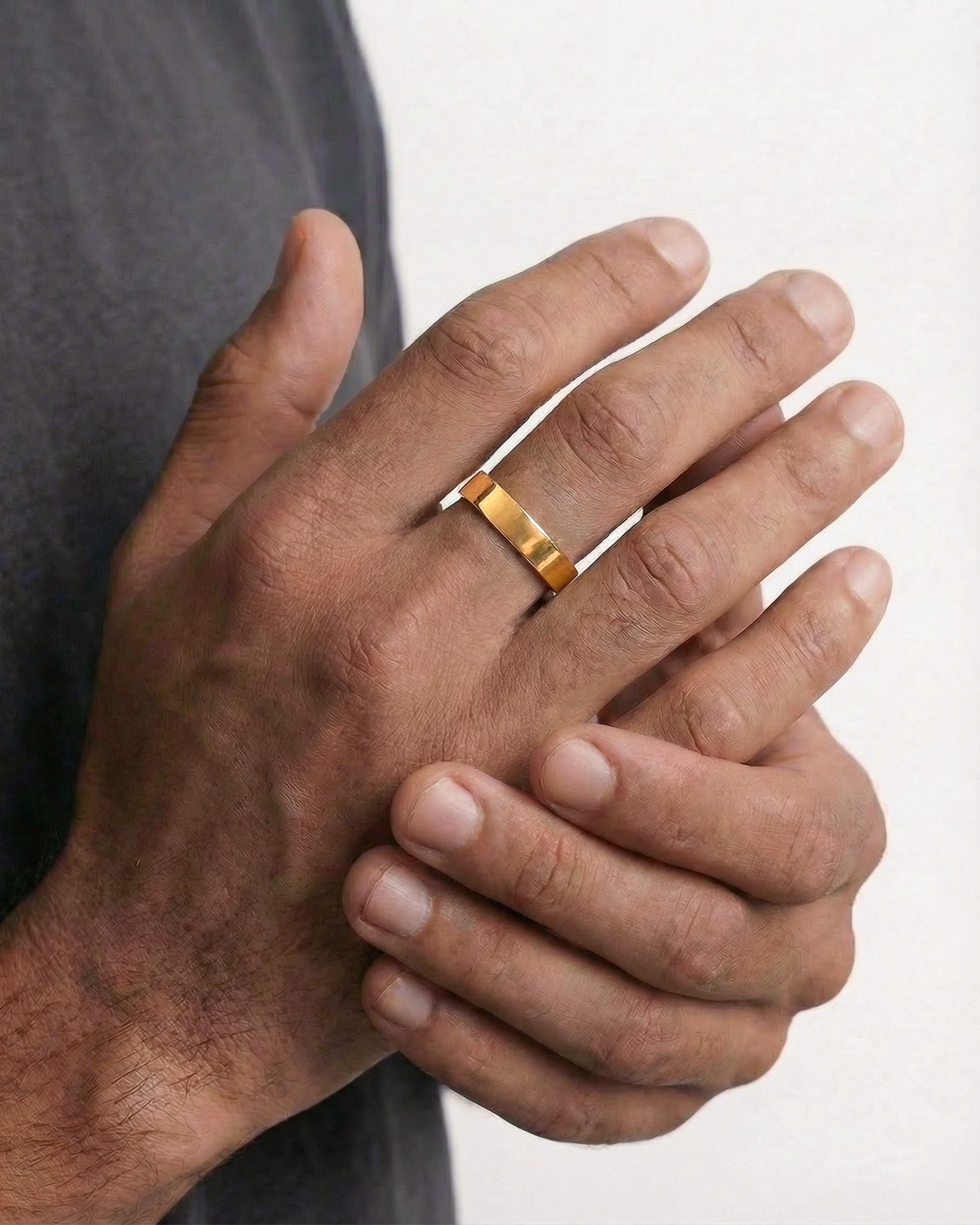 Slim adjustable gold ring on finger, 4 mm wide