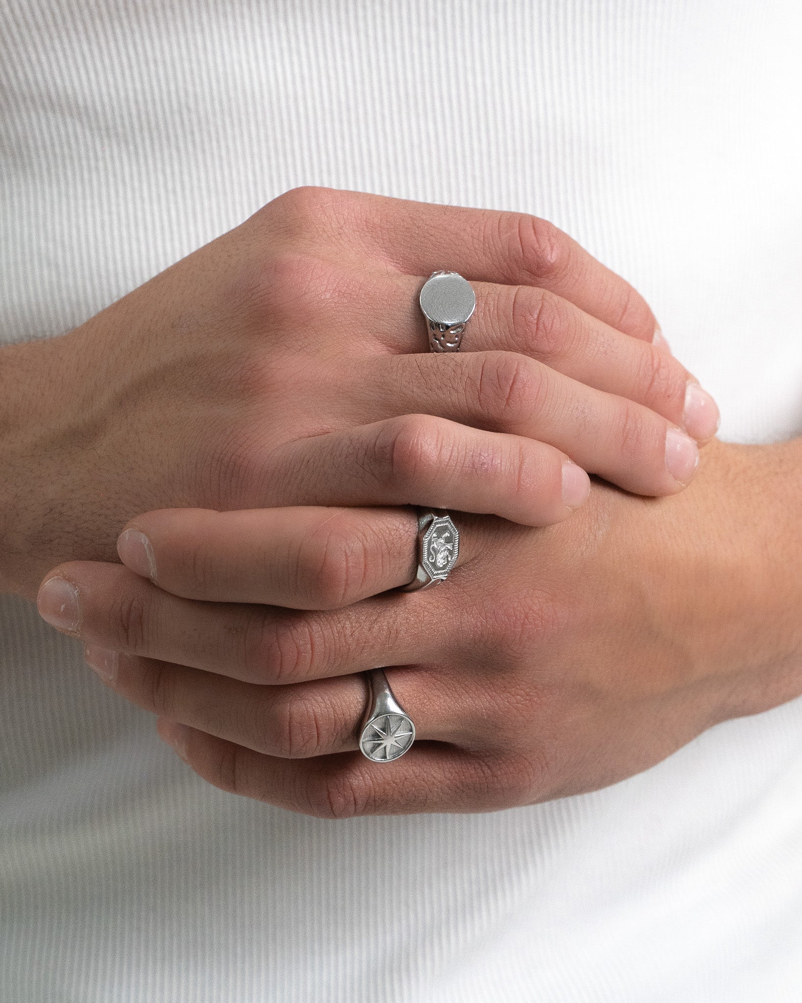 STAR SILVER RING side view with a hexagonal top and engraved detail.