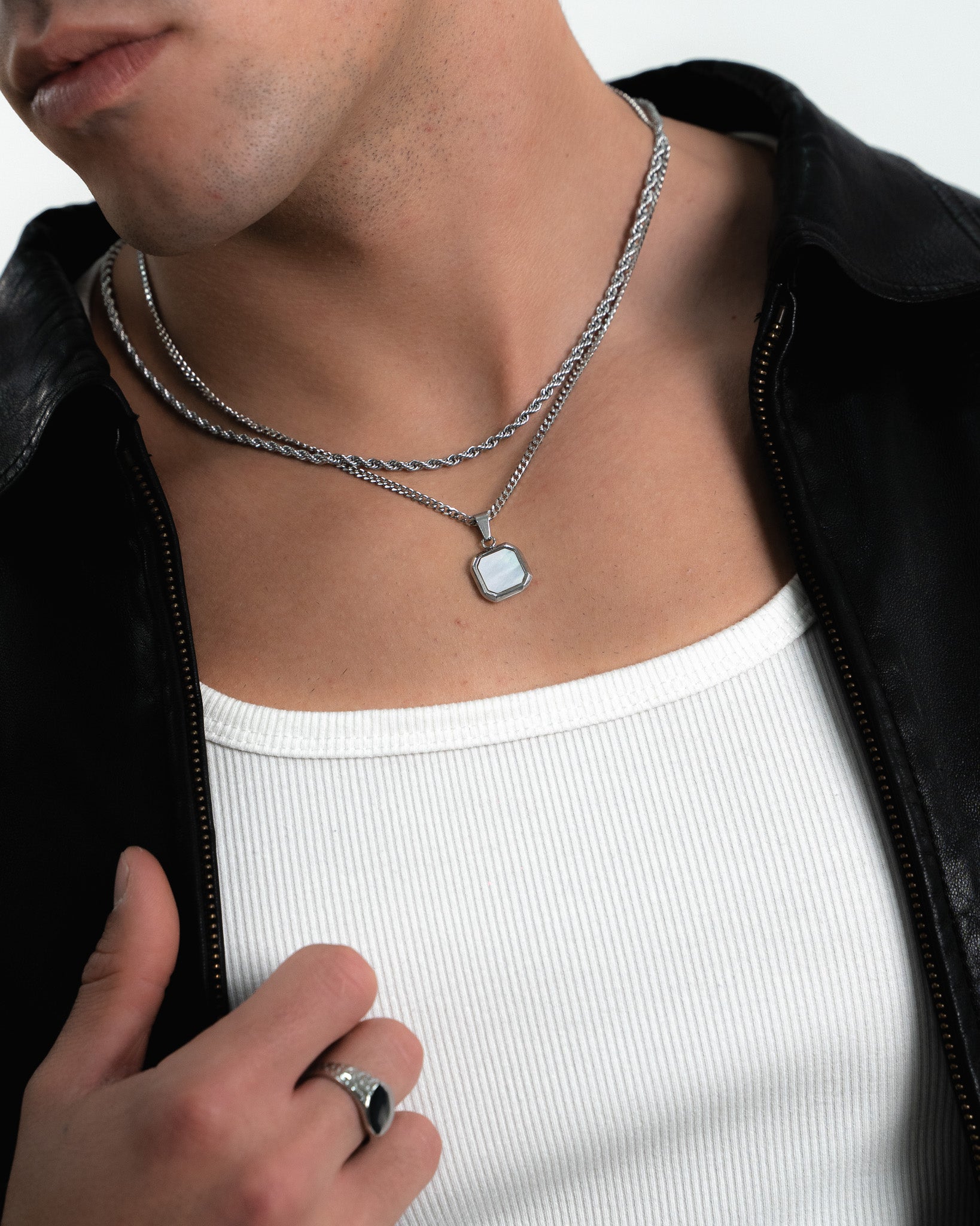Close up of NOVA Silver Necklace showing an octagonal pale stone pendant on a silver chain
