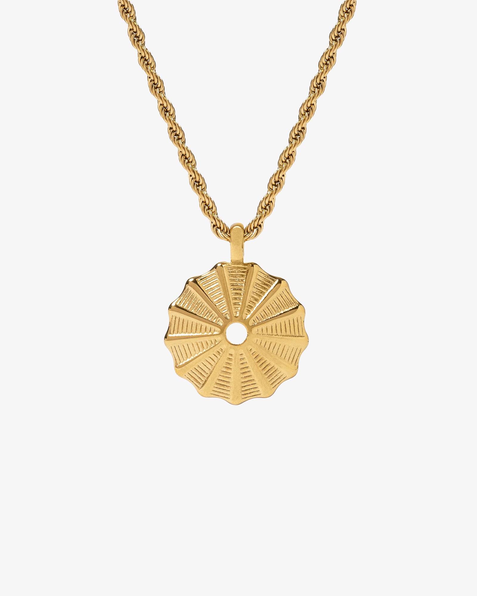 Gold rope chain necklace with a round sunburst pendant against a white background.