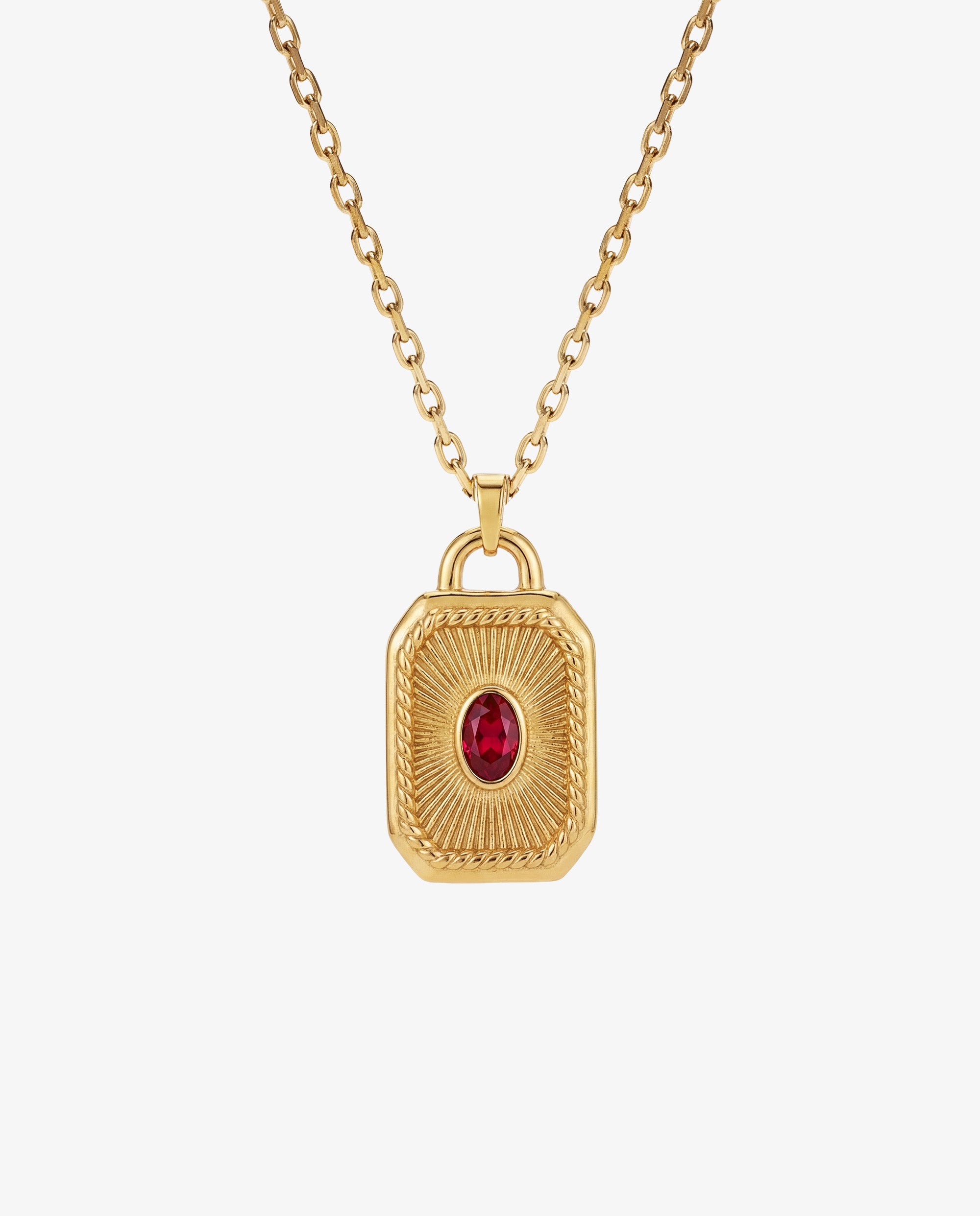 Collar de cadena de oro con colgante labrado con una gema roja