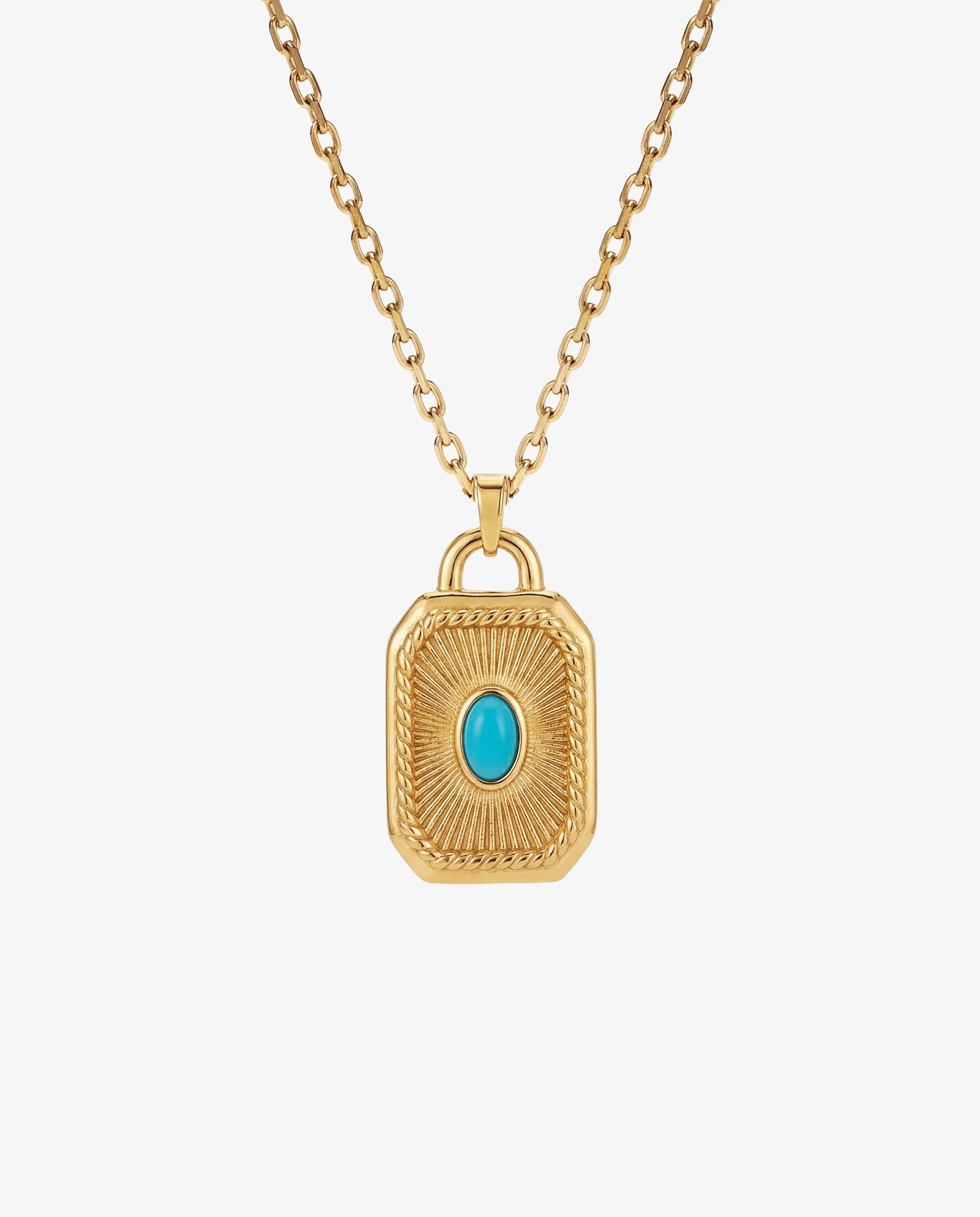 Collar AETHER de oro con colgante rectangular labrado y gema central azul turquesa.