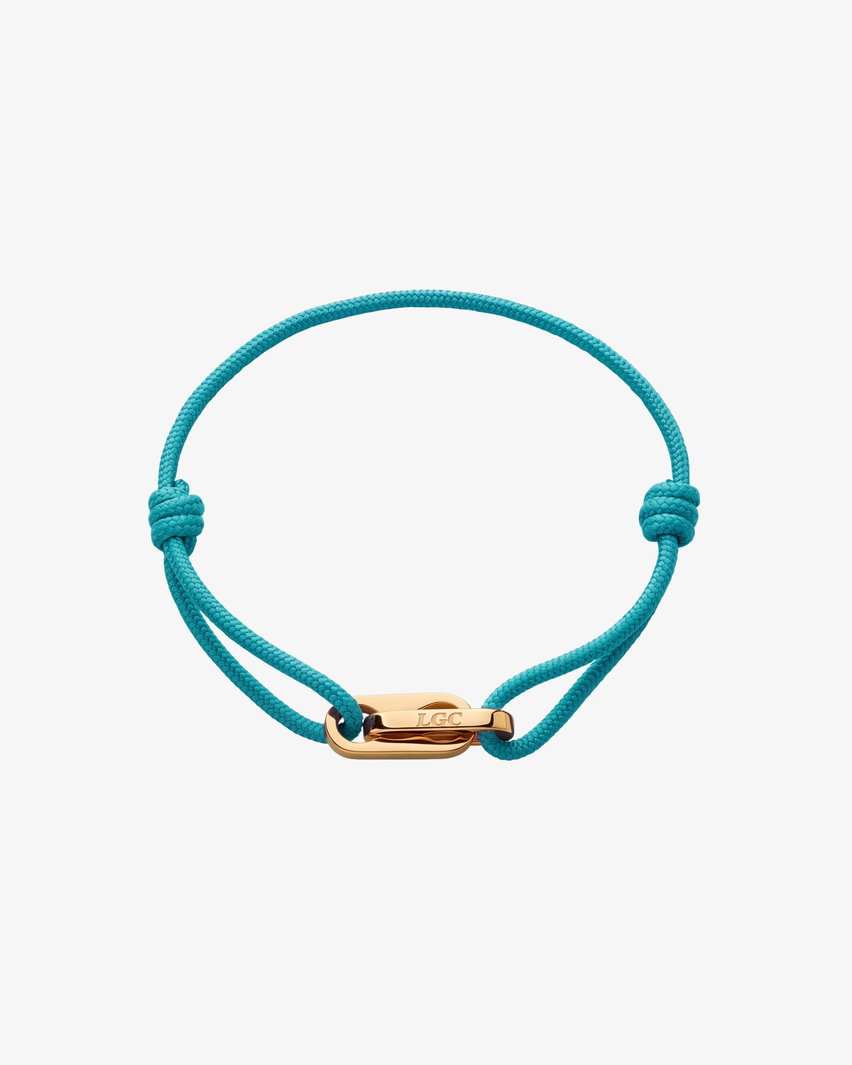 Pulsera dorada Atlantis con cordón turquesa y cierre dorado pulido.