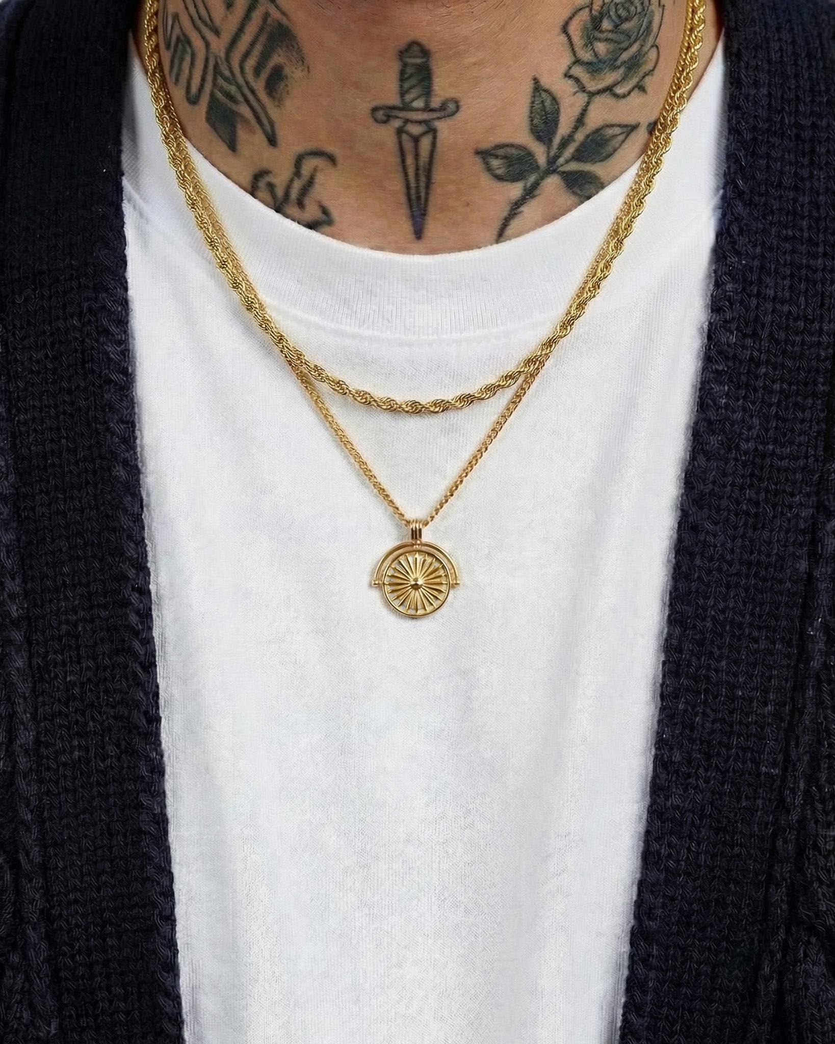 Lazio Gold Chain rope chain with sunburst pendant worn on a tattooed chest