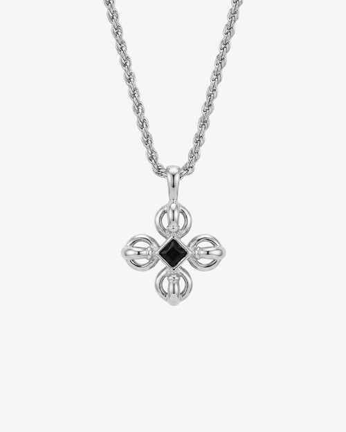 Silver chain necklace with a cross pendant featuring a central black gemstone