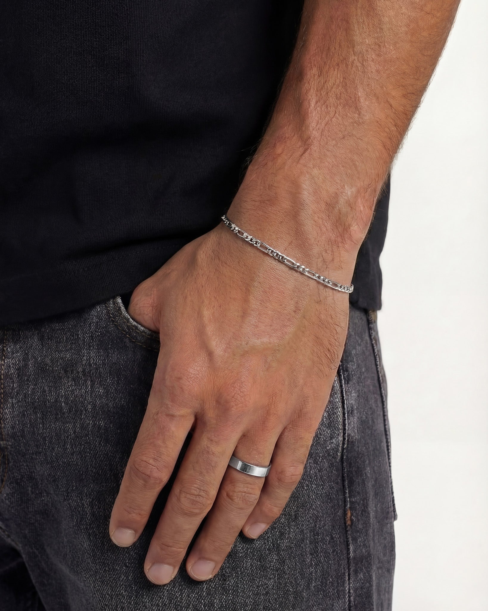 Amalfi silver bracelet with delicate chain worn on a wrist against a black shirt